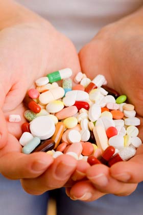 Hands full of Supplements